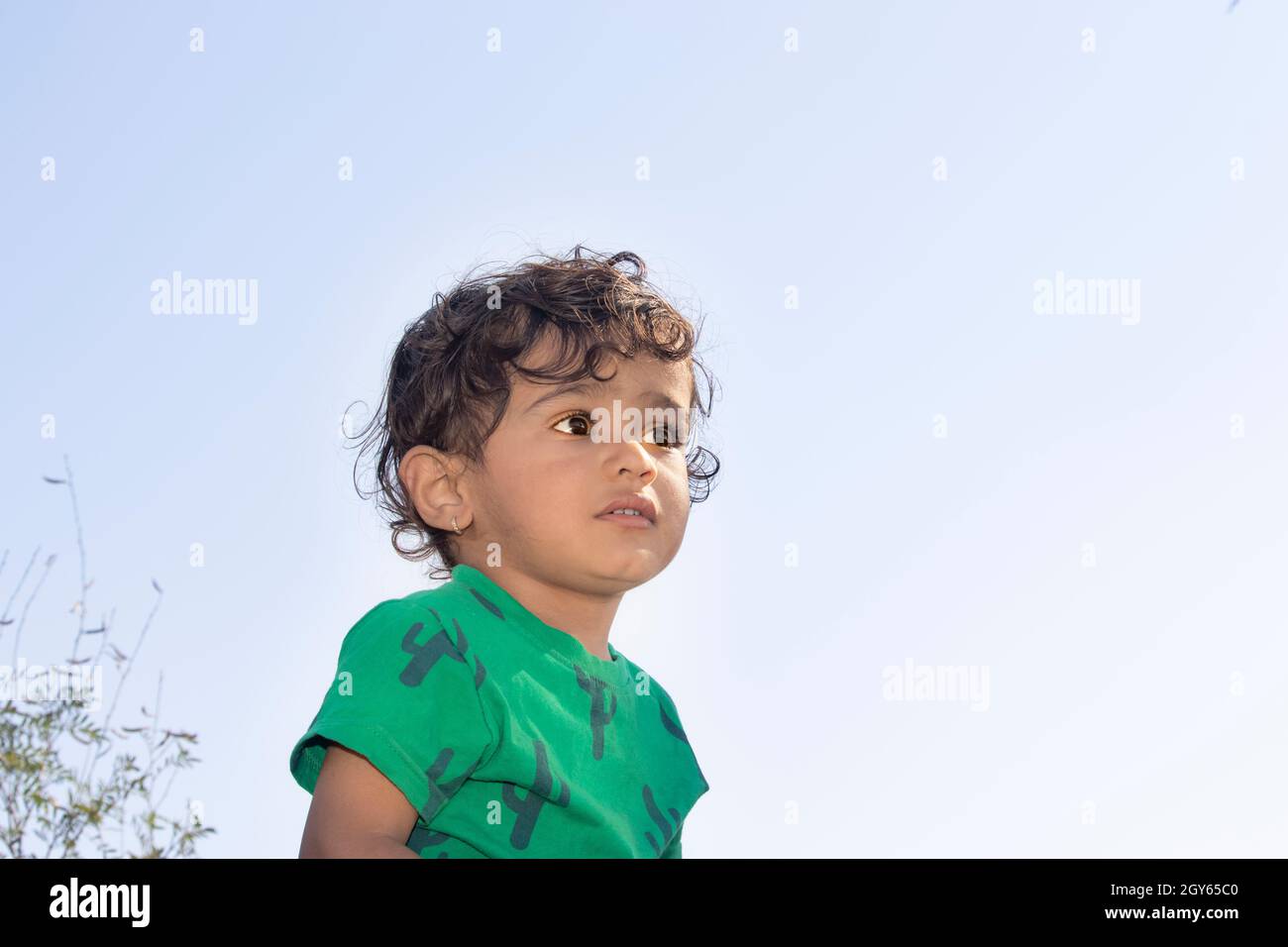Close-up portrait low angle of an indian fair little hindu boy child ...