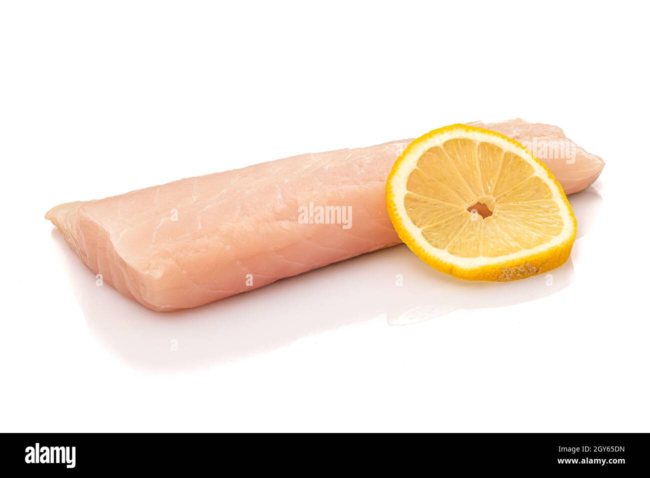 Pollaj Fish Raw pollack fish fillet with slice of lemon white isolated Stock Photo ...