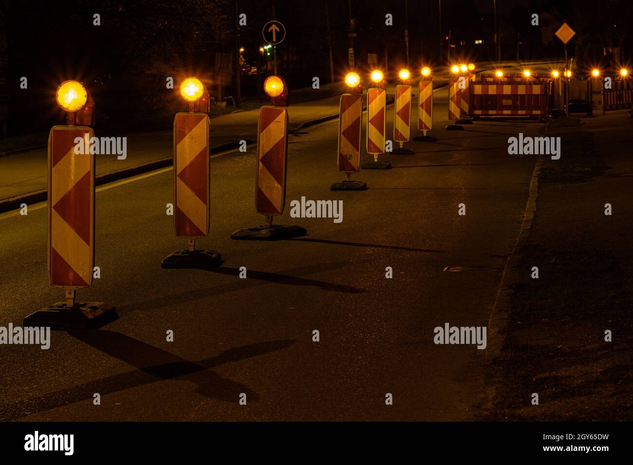 Roadworks construction with warning lights in the night Stock Photo Alamy