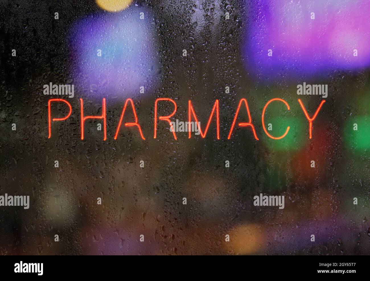 Neon Pharmacy Sign in Wet Window Stock Photo - Alamy