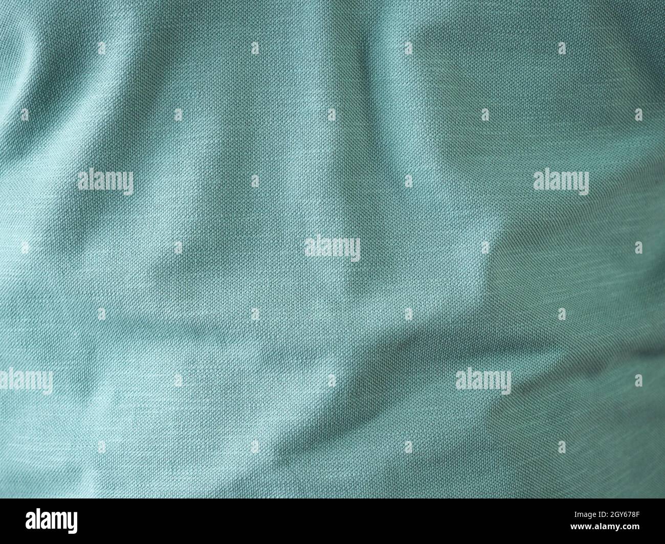 green fabric texture useful as a background Stock Photo - Alamy