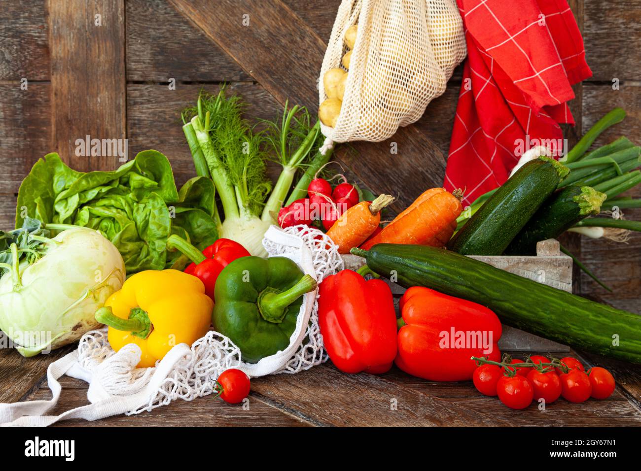 Colorful variety of fresh vegetables on rustic wooden background Stock Photo