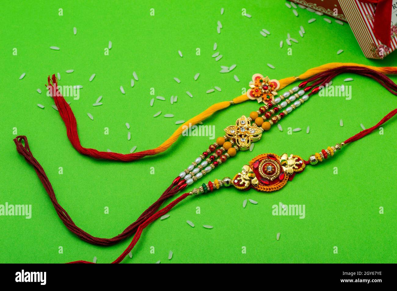 Raksha Bandhan background with an elegant Rakhi. A traditional Indian ...