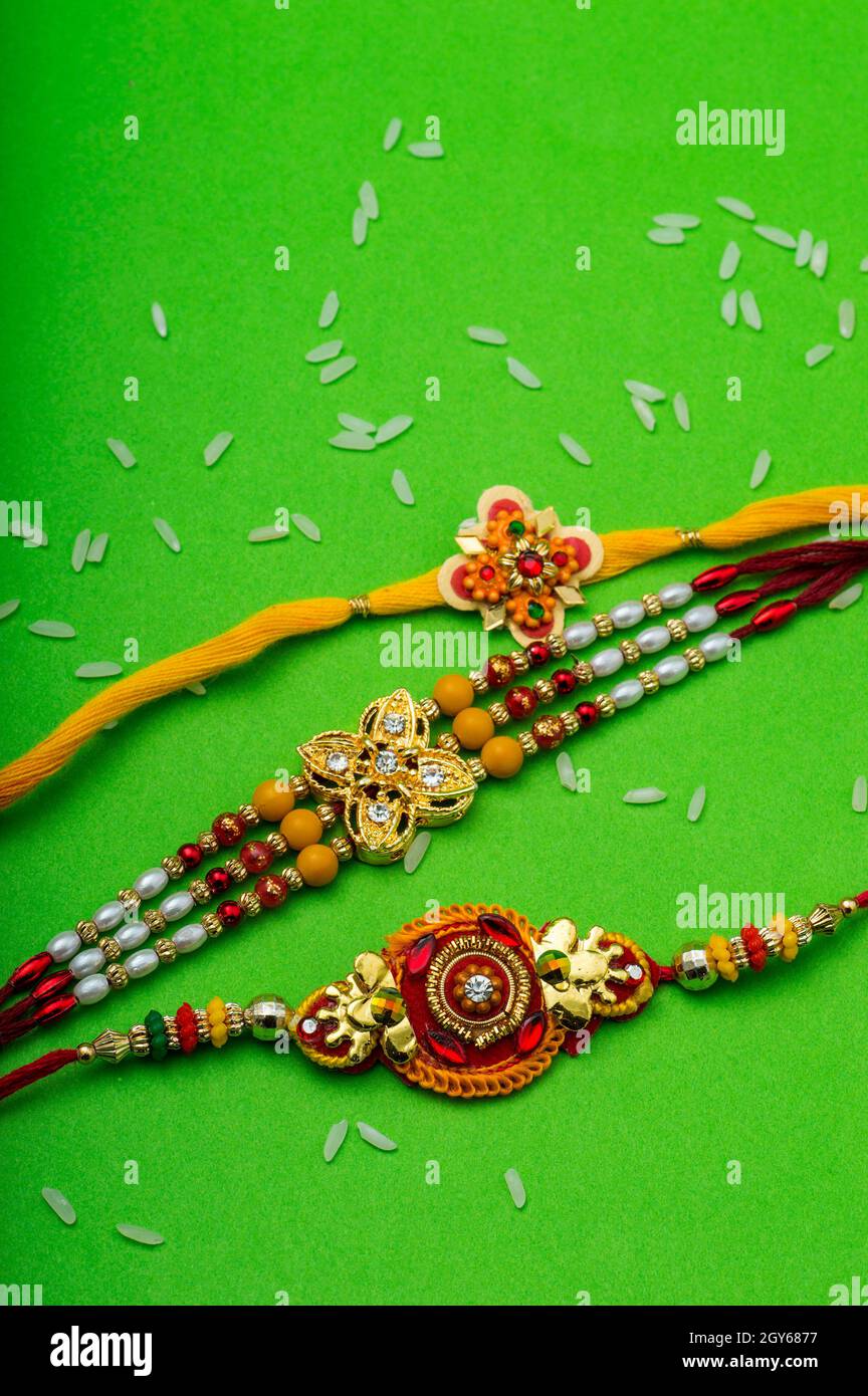 Raksha Bandhan background with an elegant Rakhi. A traditional Indian ...