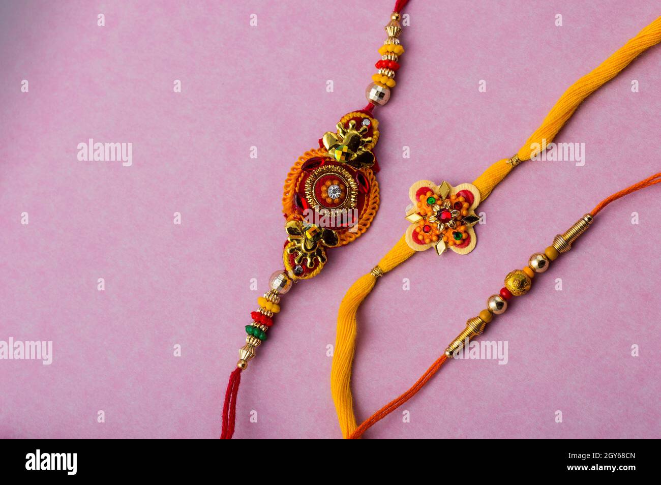 Raksha Bandhan background with an elegant Rakhi. A traditional Indian ...