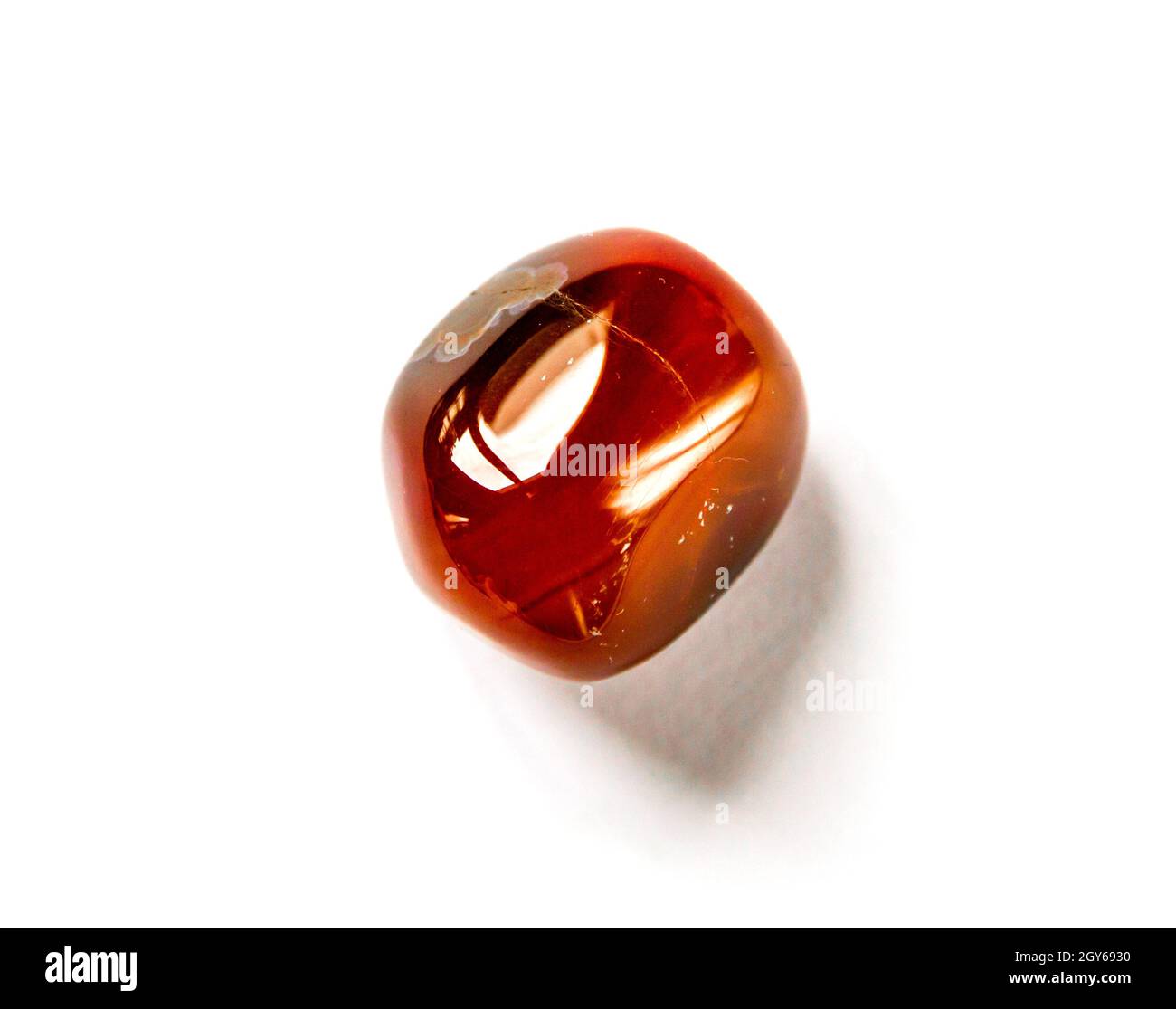 Carnelian agate gemstone isolated on a white background Stock Photo