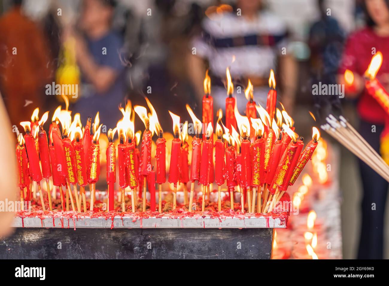 The burning incense and candle worship in Buddhism Stock Photo Alamy