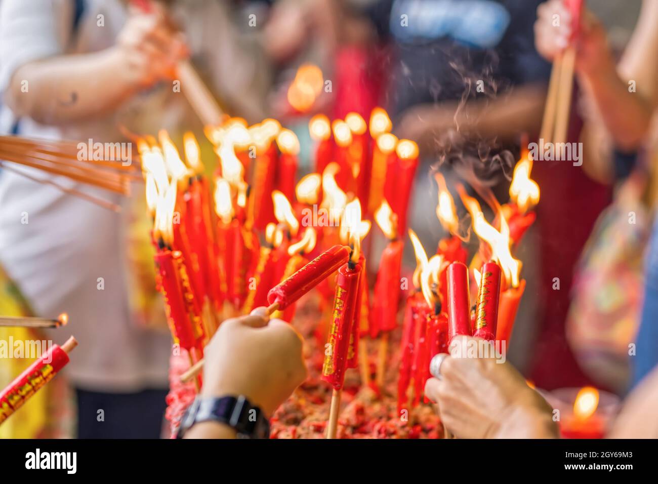 The burning incense and candle worship in Buddhism Stock Photo Alamy