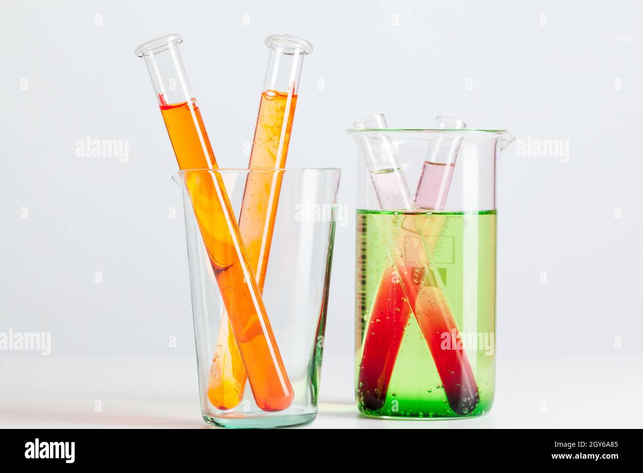 Test flasks with color samples on light grey background Stock Photo - Alamy