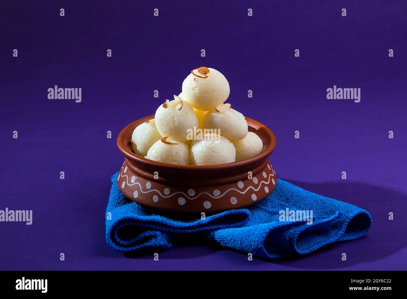 Cream Rasgulla Indian Sweet or Dessert - Rasgulla, Famous Bengali sweet in clay bowl ...