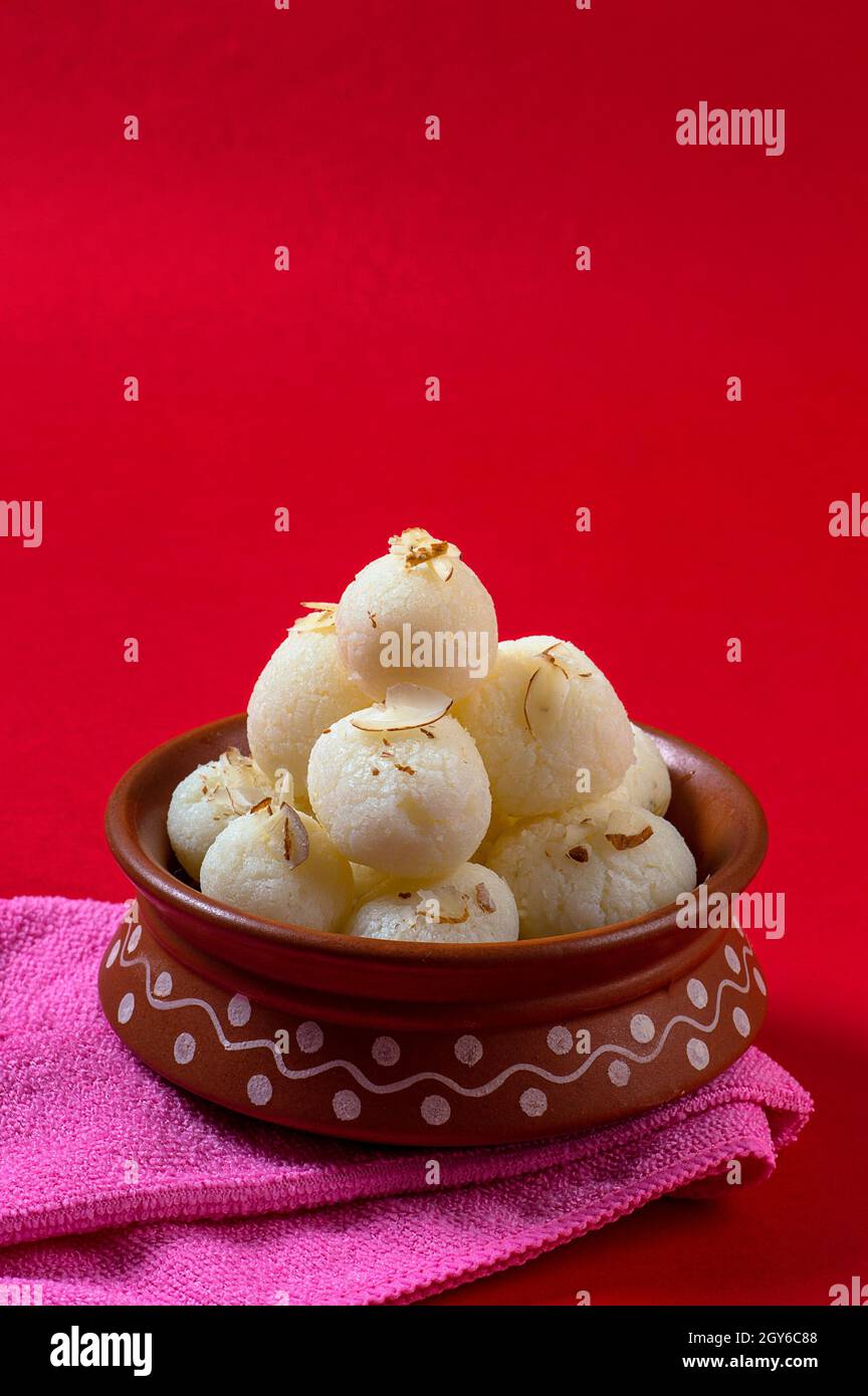 Cream Rasgulla Indian Sweet or Dessert - Rasgulla, Famous Bengali sweet in clay bowl ...