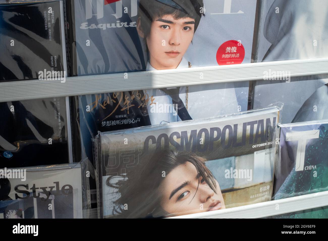 Fashion magazines on shelf at a newsstand in Beijing, China. 07-Oct-2021 Stock Photo