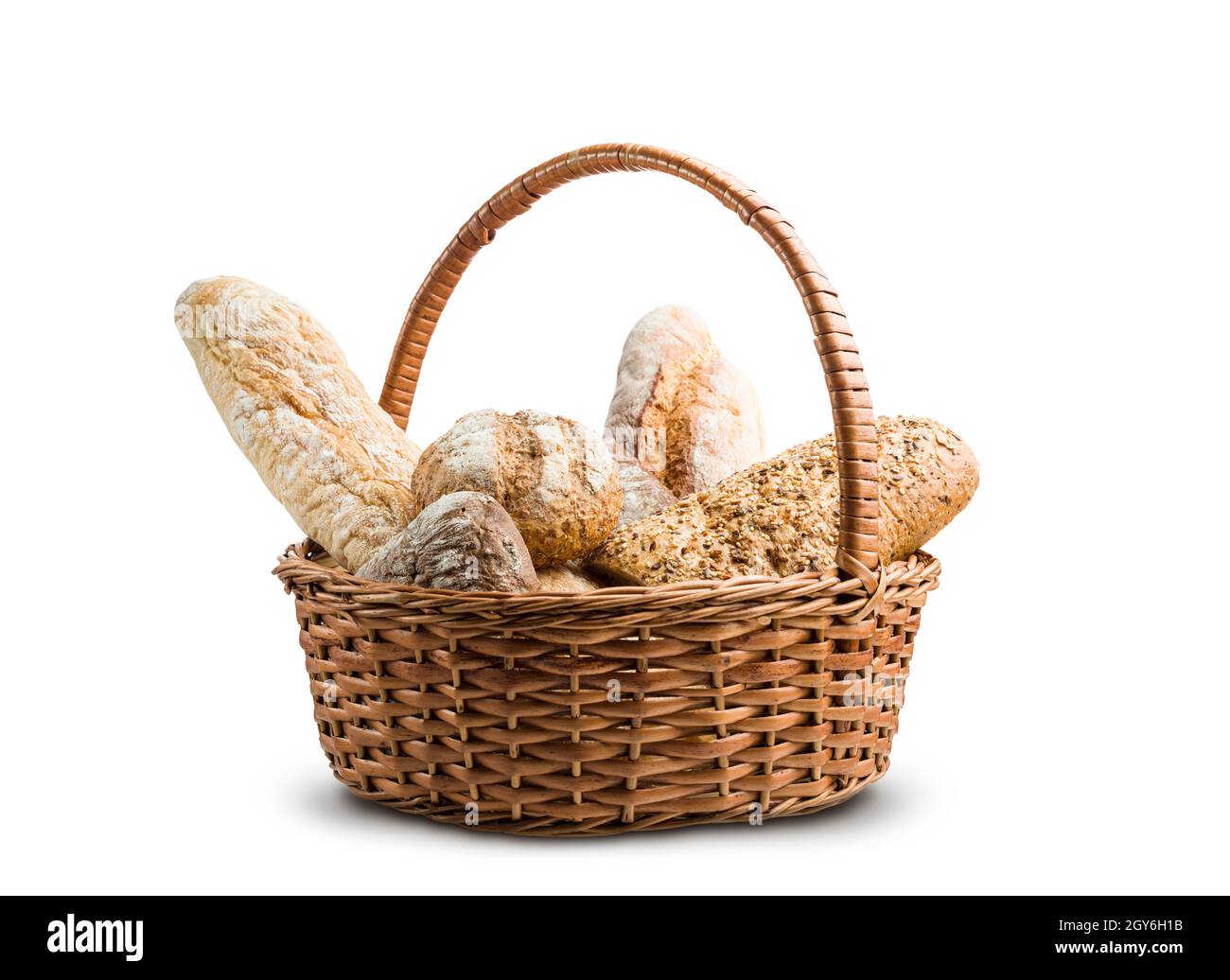 assortment of baked bread in wicker basket on white background Stock Photo