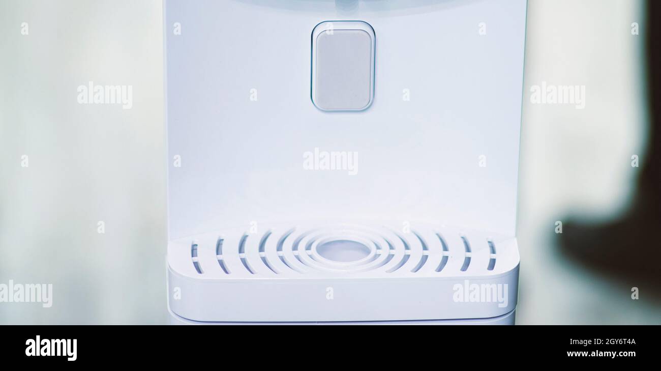 water cooler button on a blurry background Stock Photo Alamy