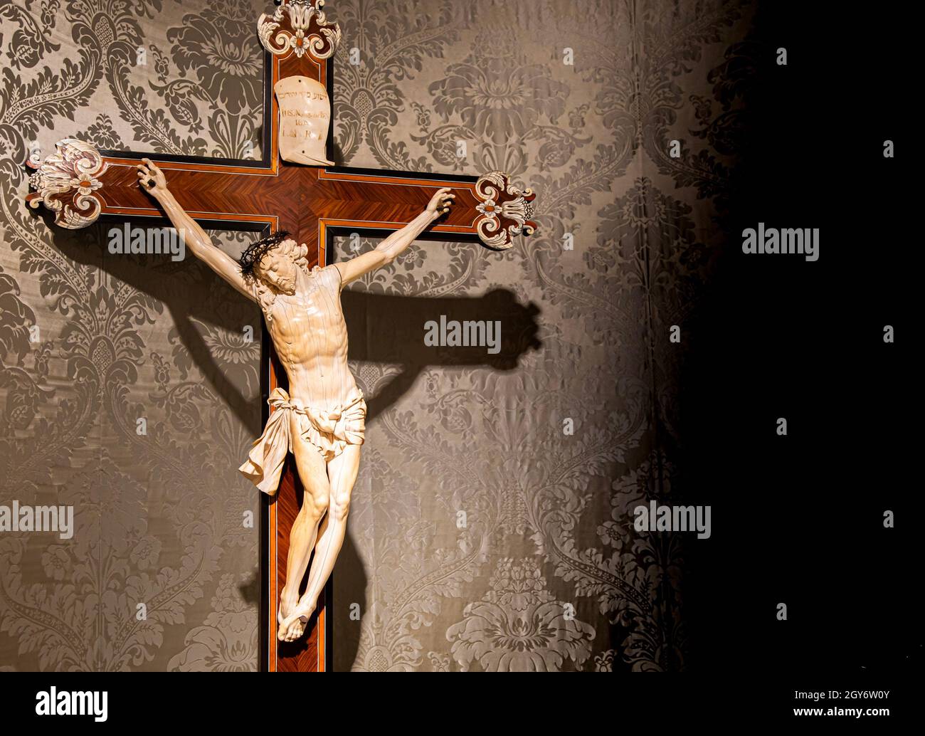 TURIN, ITALY CIRCA MAY 2021 old crucifix made of wood and ivory