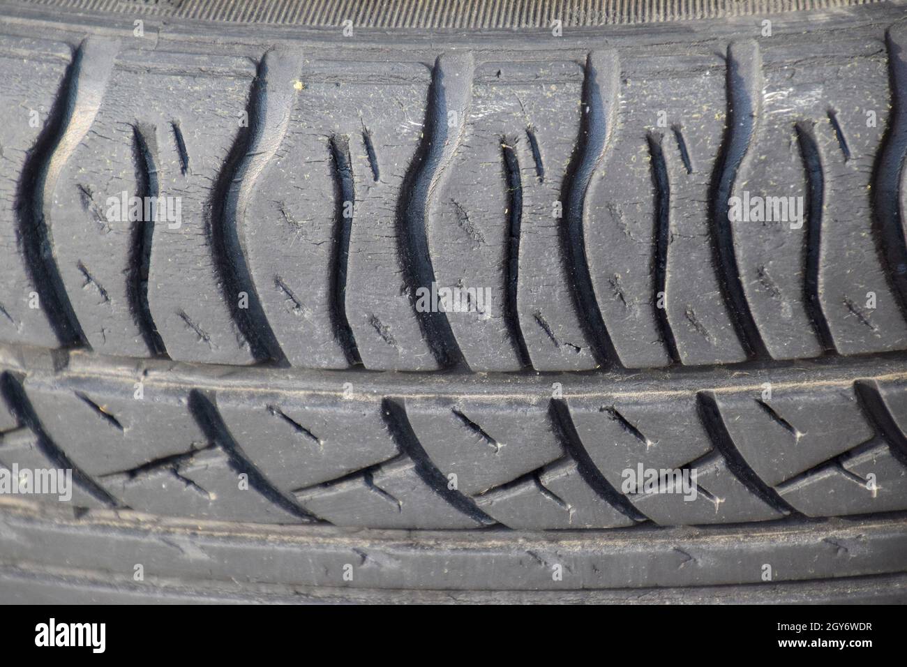 The background of the tread pattern of the car wheel. Rubber tires