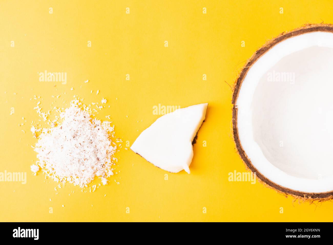 Happy coconuts day concept, fresh coconut group set different half and slices, studio shot isolated on yellow background Stock Photo