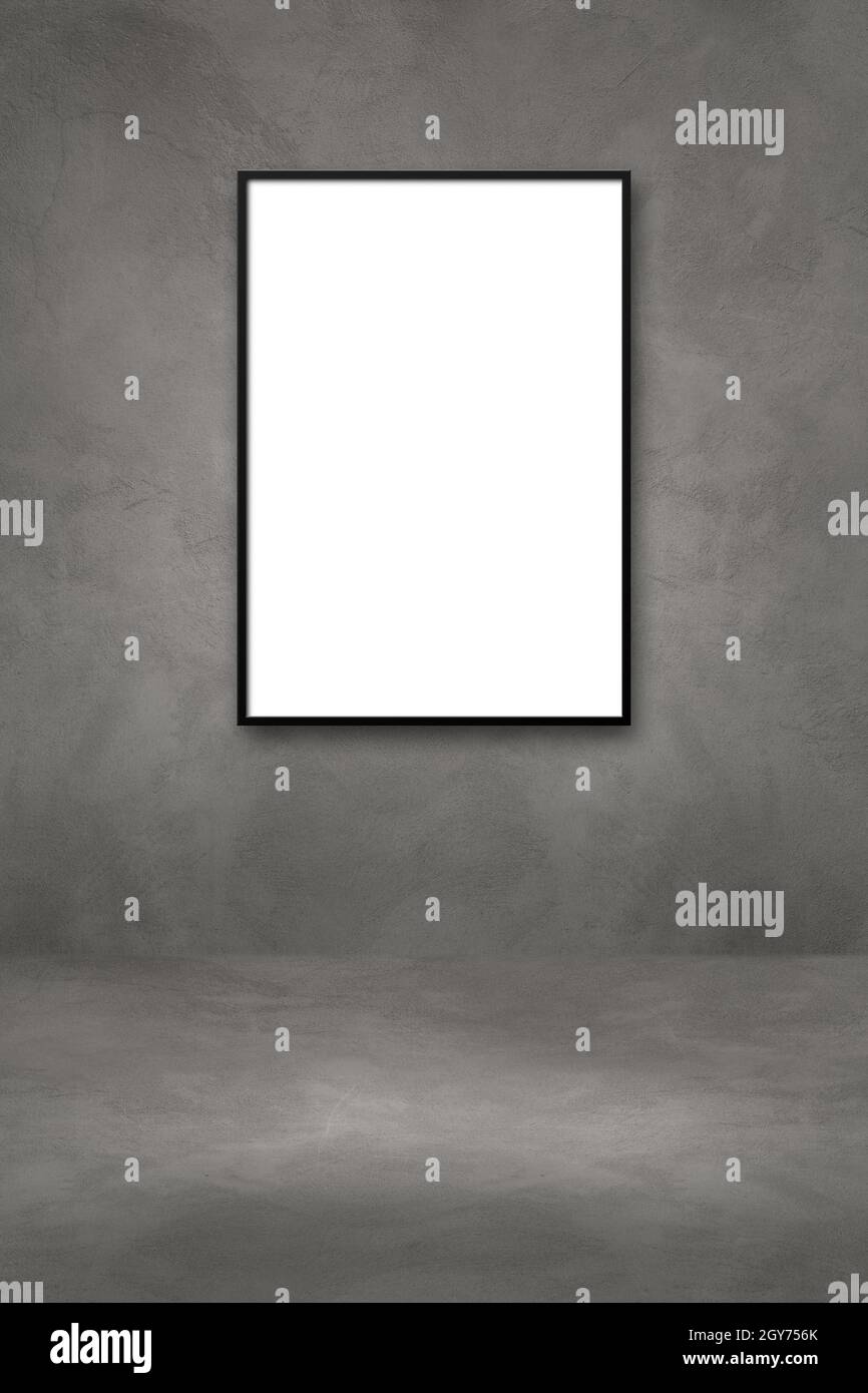 Black picture frame hanging on a dark concrete wall. Blank mockup ...