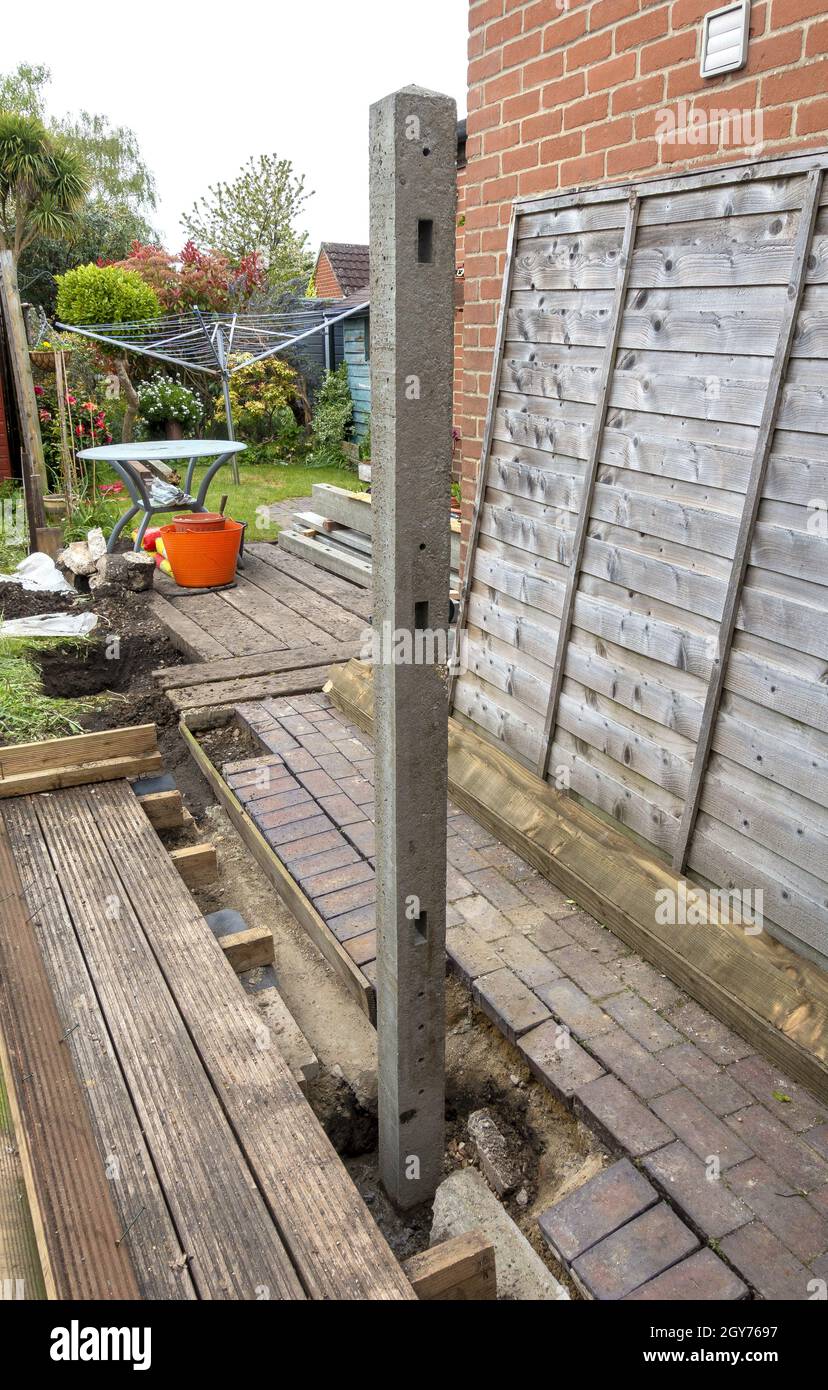 The installation of new concrete fence posts Stock Photo Alamy