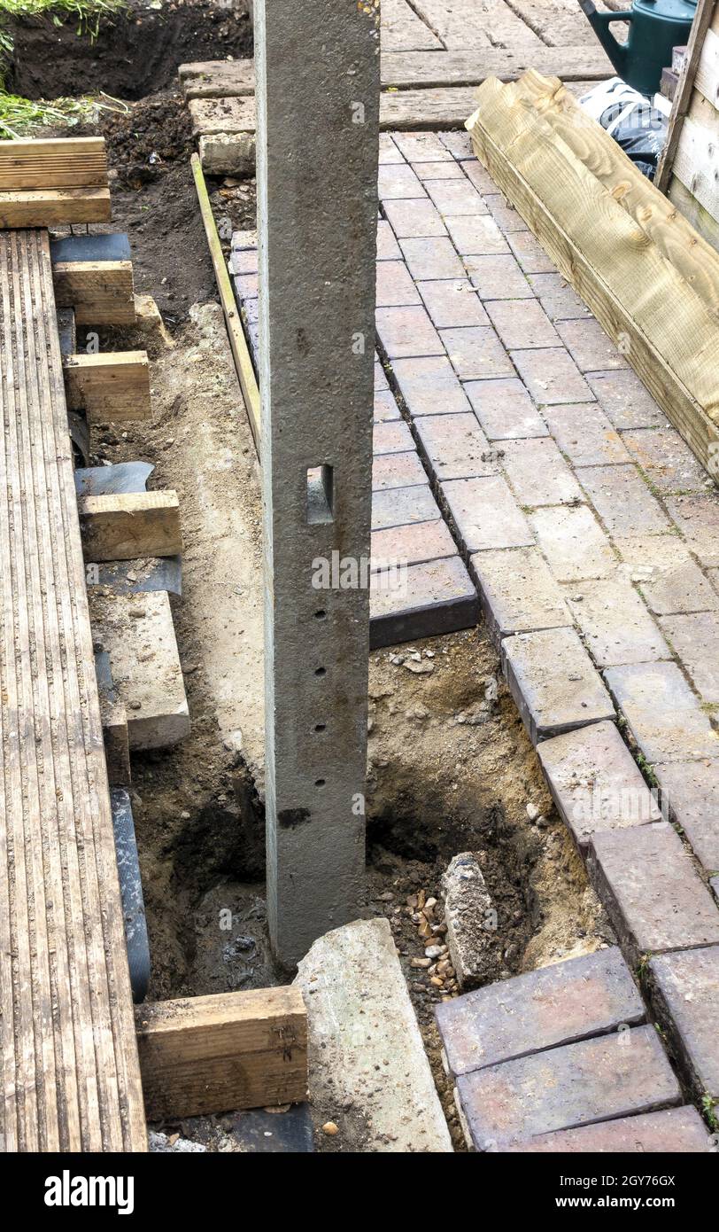 The installation of new concrete fence posts Stock Photo Alamy