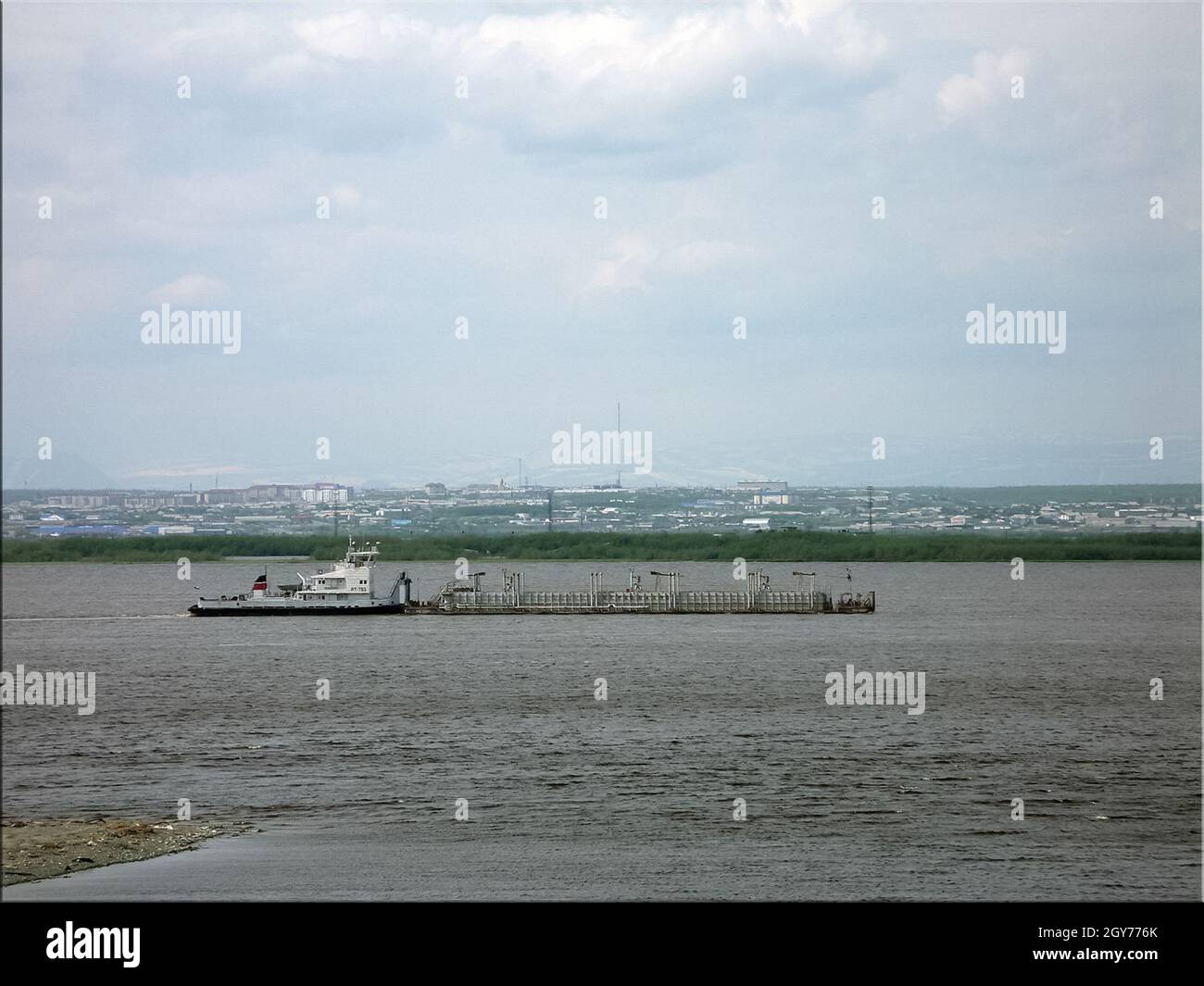 River port on the river of the city of Salekhard. Port cranes and ships ...