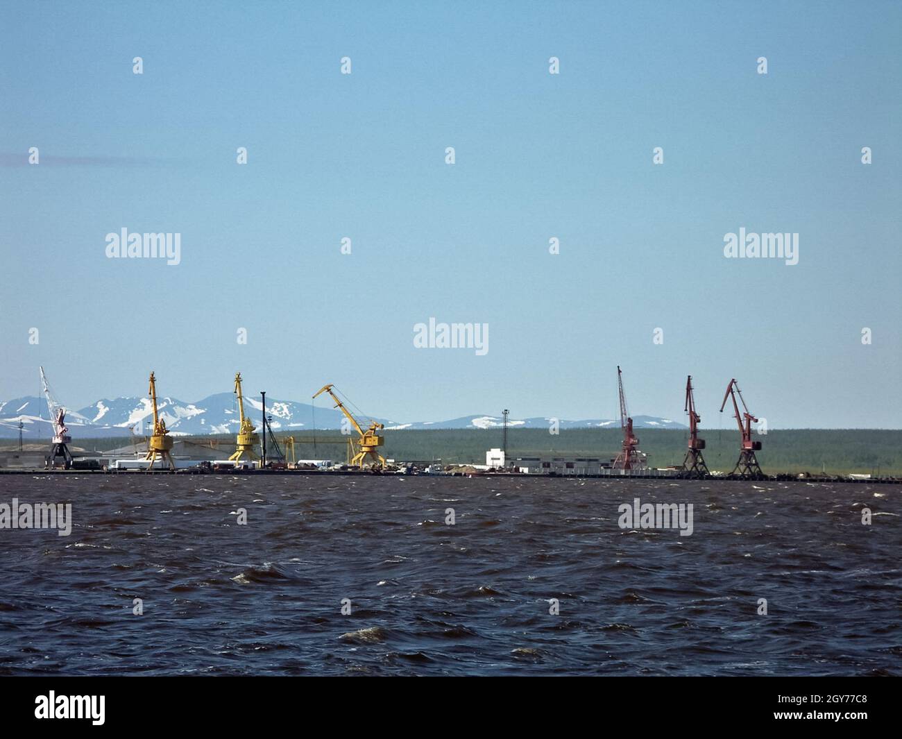 River port on the river of the city of Salekhard. Port cranes and ships ...