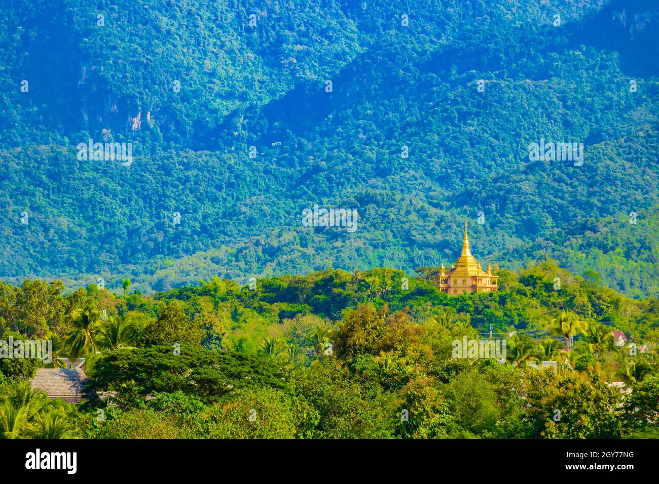 Panorama of the mountain landscape and Wat Phol Phao temple in Luang Prabang city in Laos world tour in Southeast Asia. Stock Photo