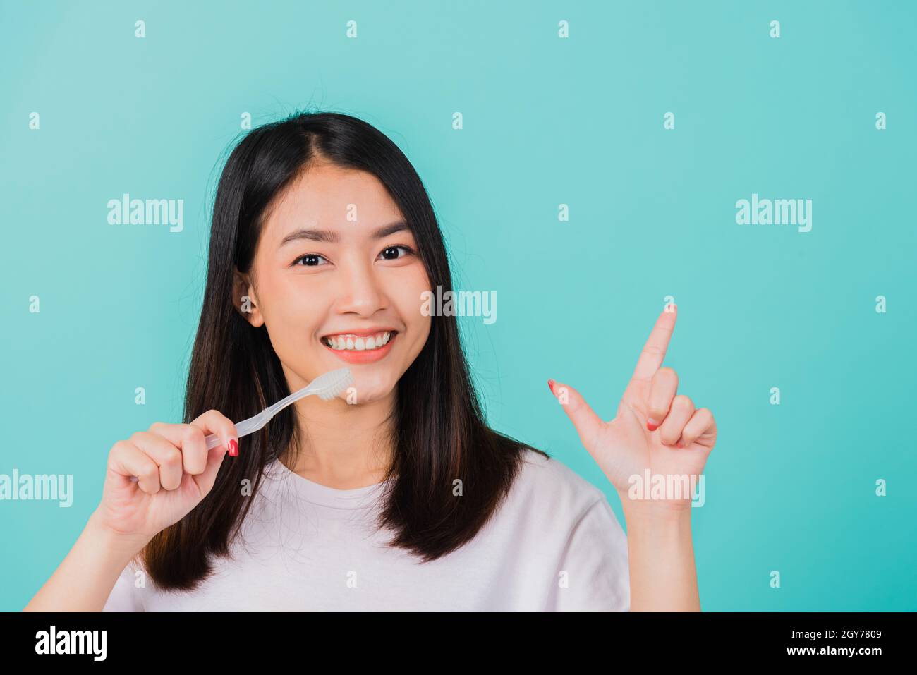 Portrait Asian beautiful young woman teen smiling holding toothbrush