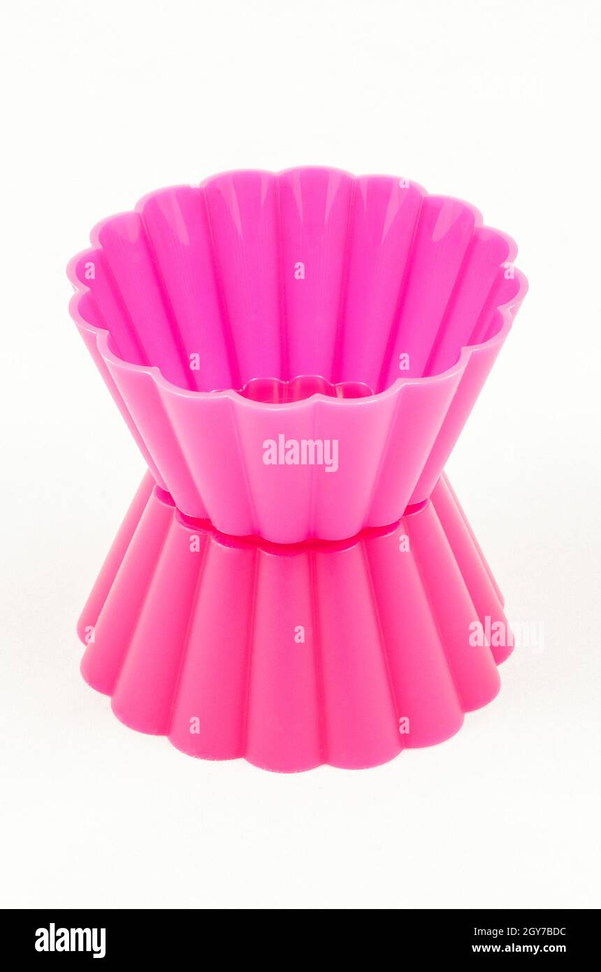 Pink silicone cake cups isolated on white background Stock Photo