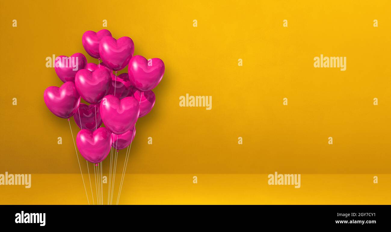 Pink heart shape balloons bunch on a yellow wall background. Horizontal ...