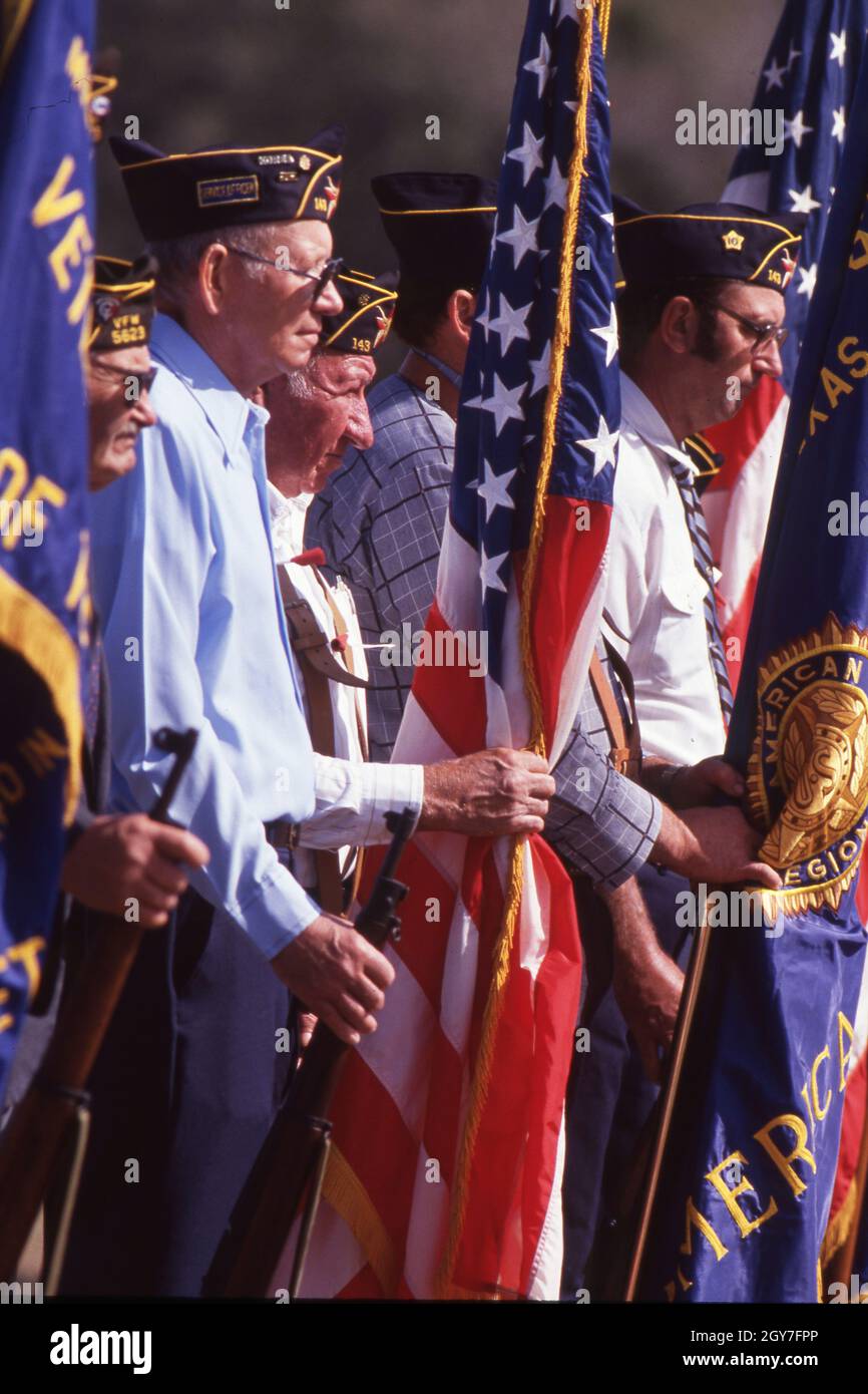 Praha Texas USA, November 11 1996: Military veterans hold American and other flags during Veterans Day ceremony in this traditionally Czech town in Central Texas. © Bob Daemmrich Stock Photo