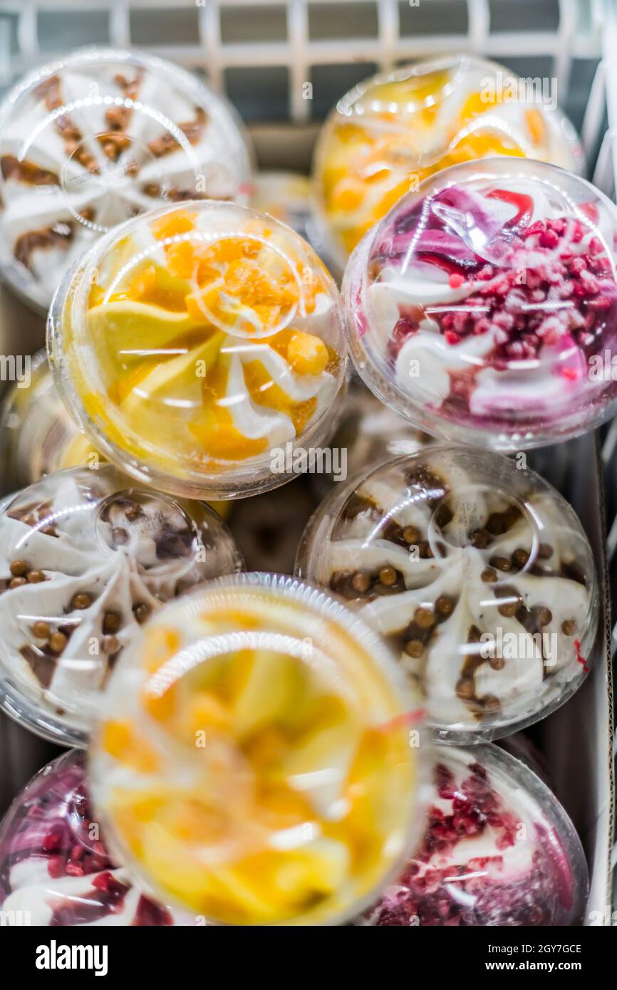 Ice cream products put up for sale in a commercial refrigerator Stock