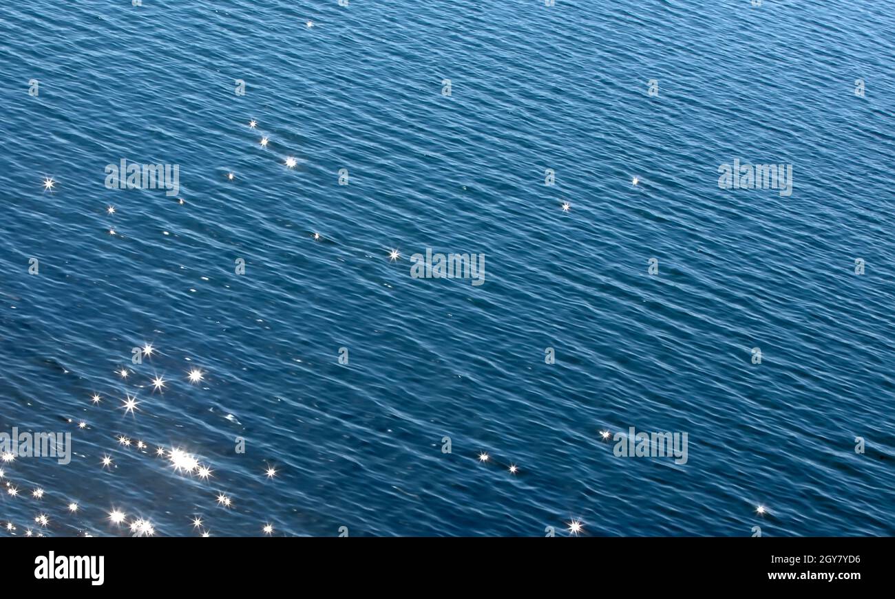 the surface of the blue sea with solar glare Stock Photo - Alamy
