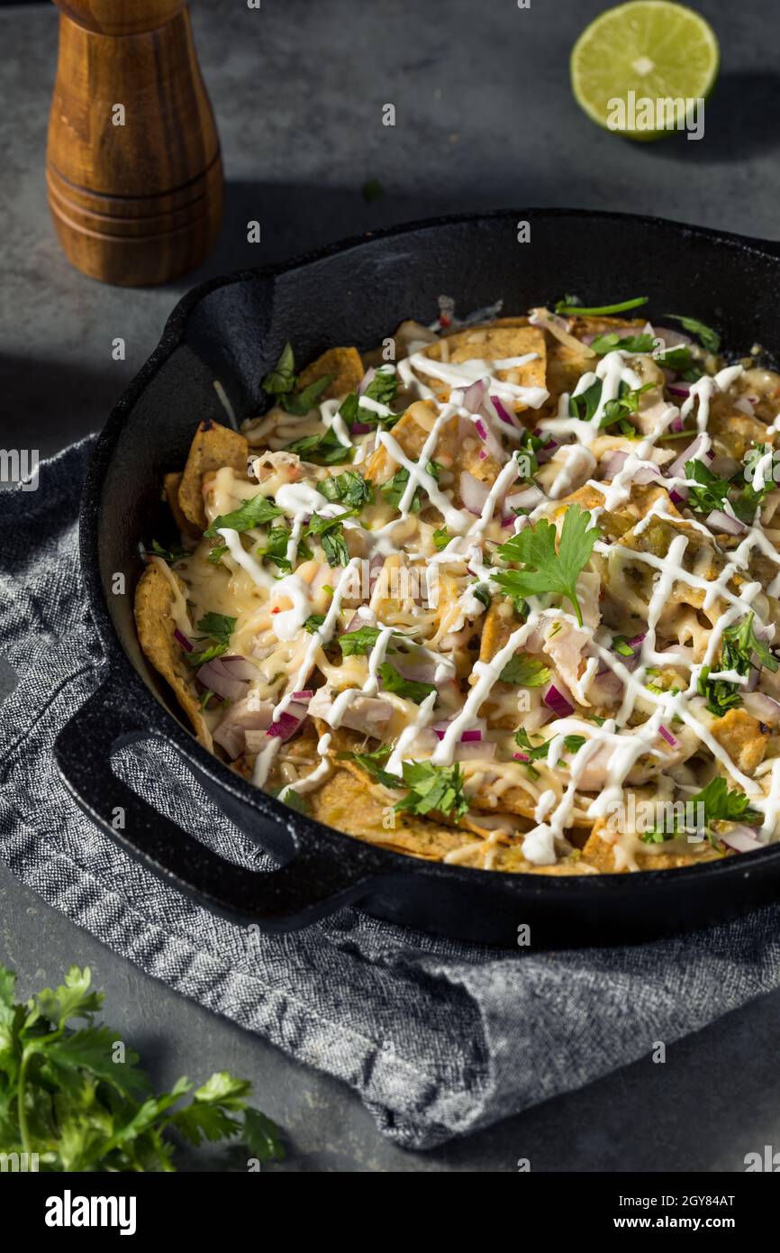 Homemade Mexican Green Chilaquiles with Tomatillo and Chicken Stock Photo Alamy