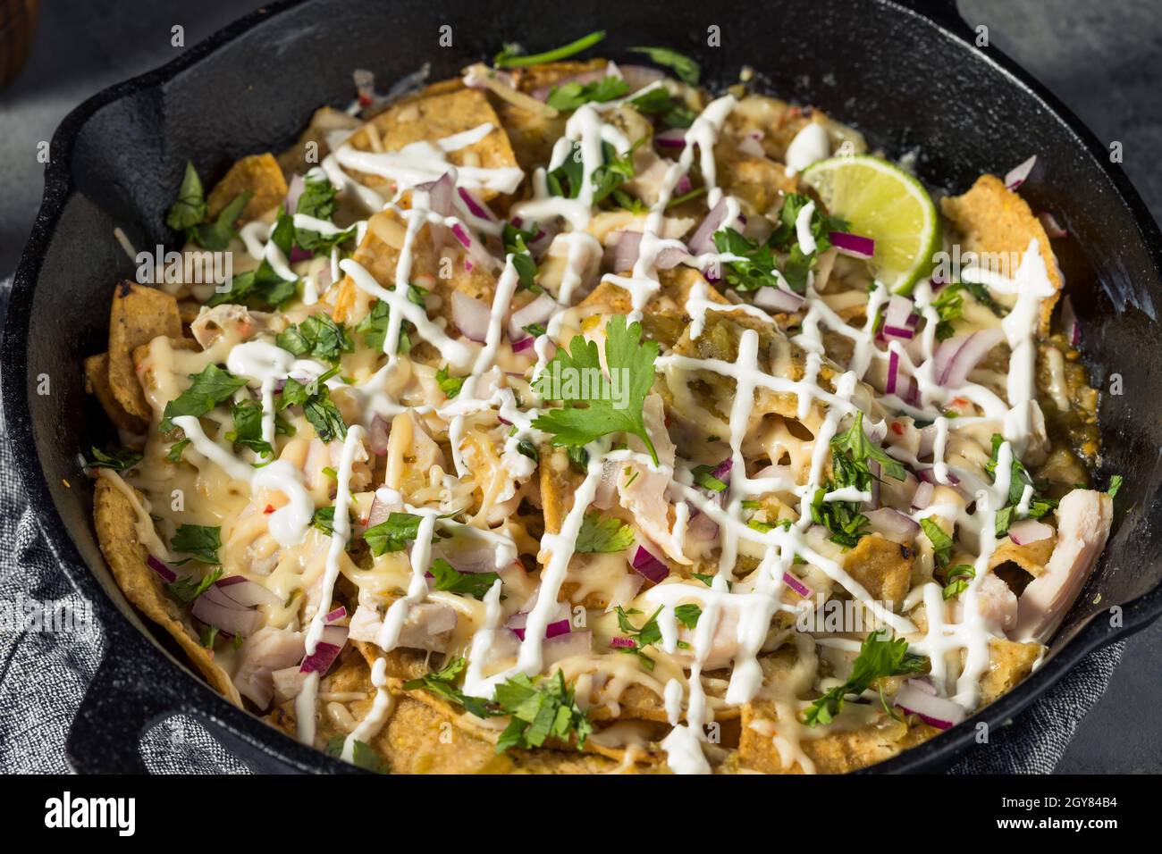 Homemade Mexican Green Chilaquiles with Tomatillo and Chicken Stock Photo