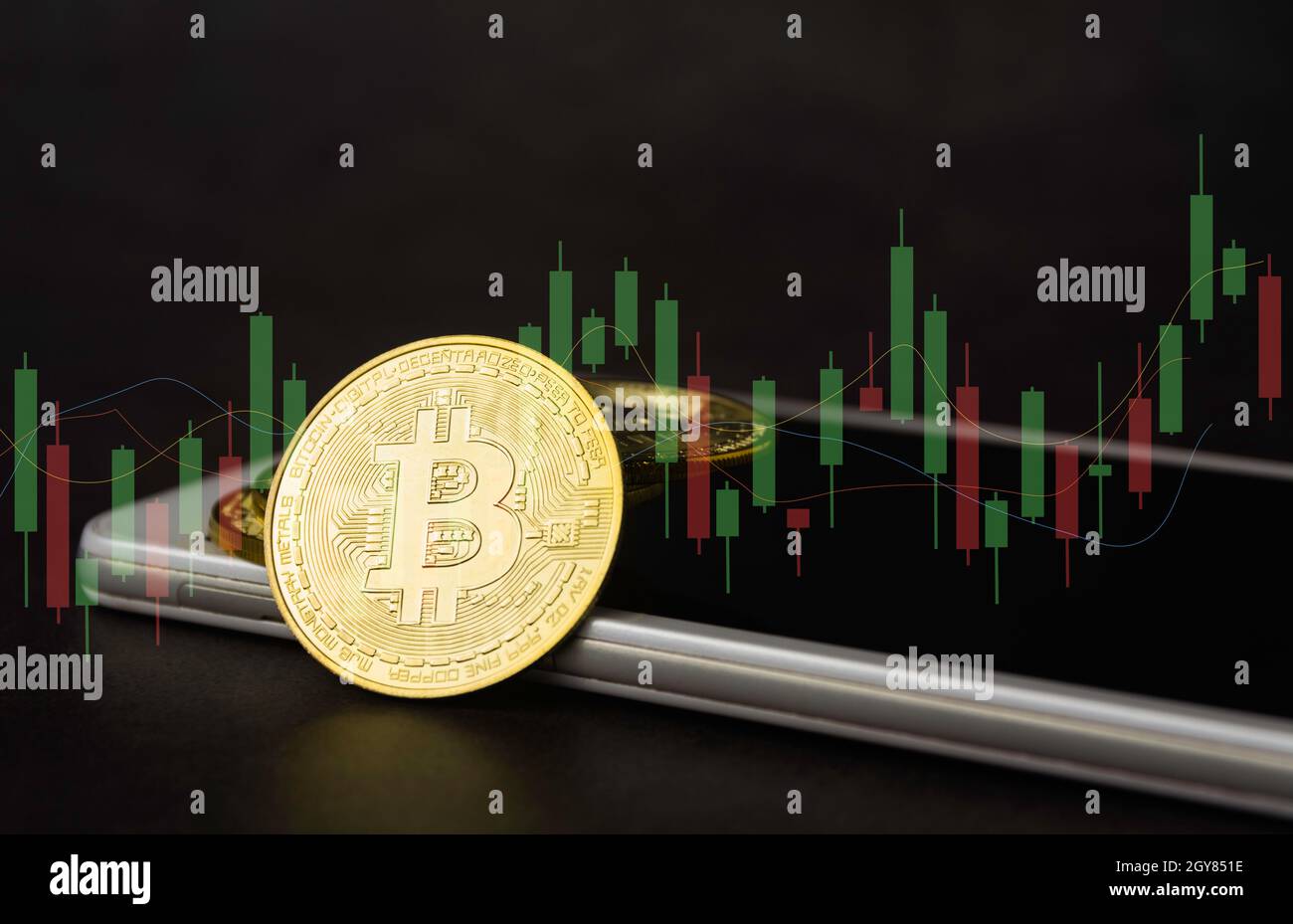 Saving money concept with Bitcoin and smart phone. financial and accounting  concept Stock Photo - Alamy