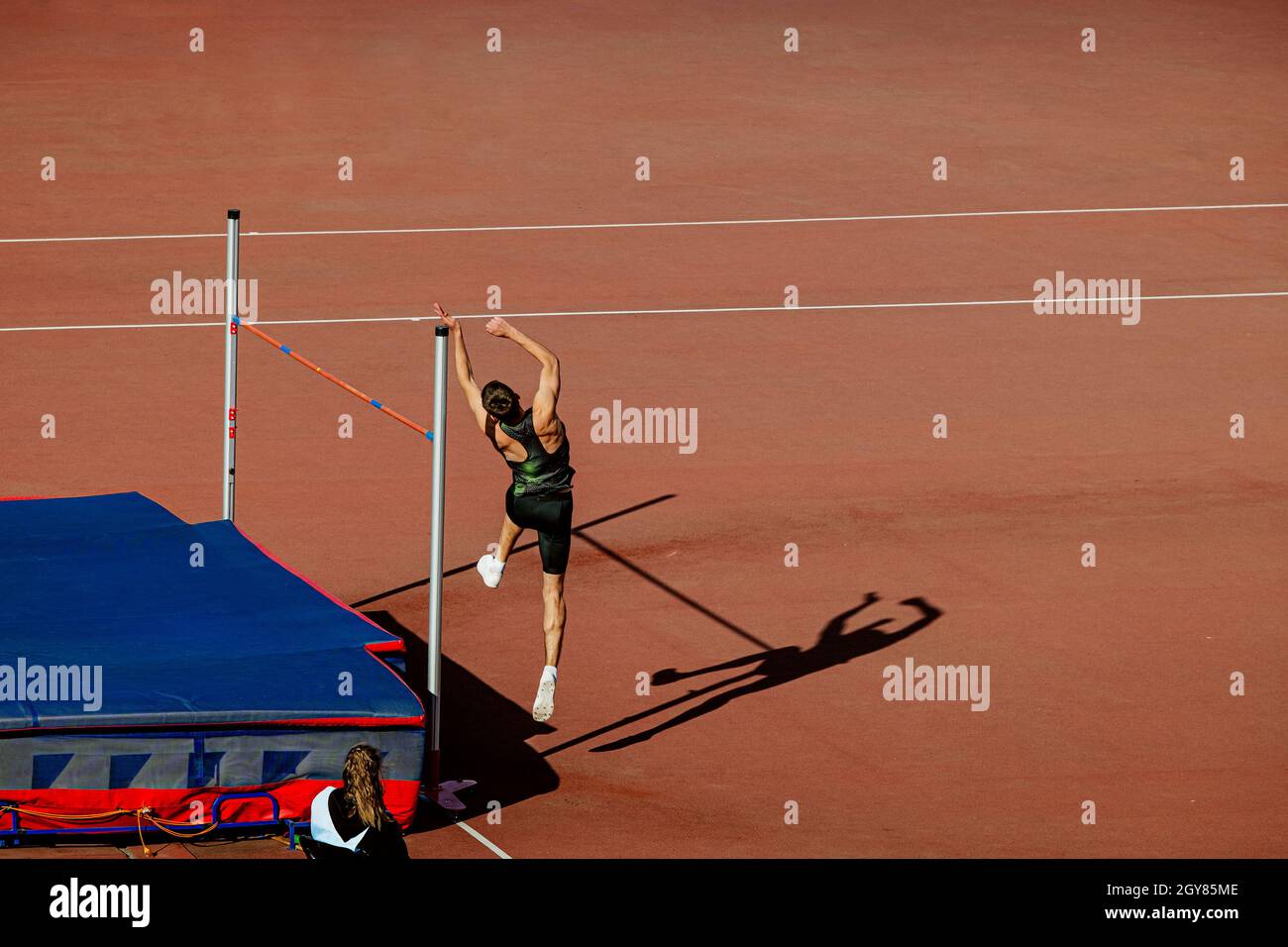 male athlete high jump in athletics competition Stock Photo