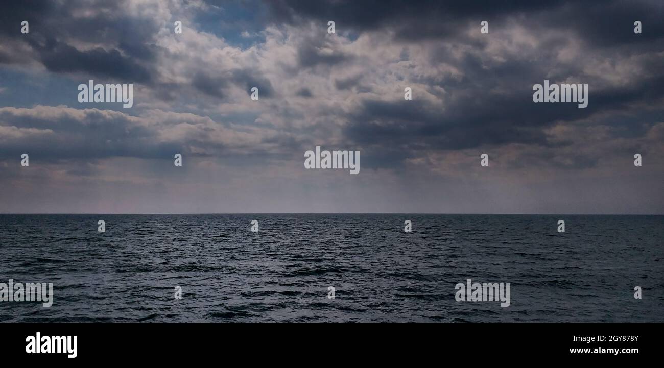 stormy background: dark sea and dramatic clouds Stock Photo - Alamy