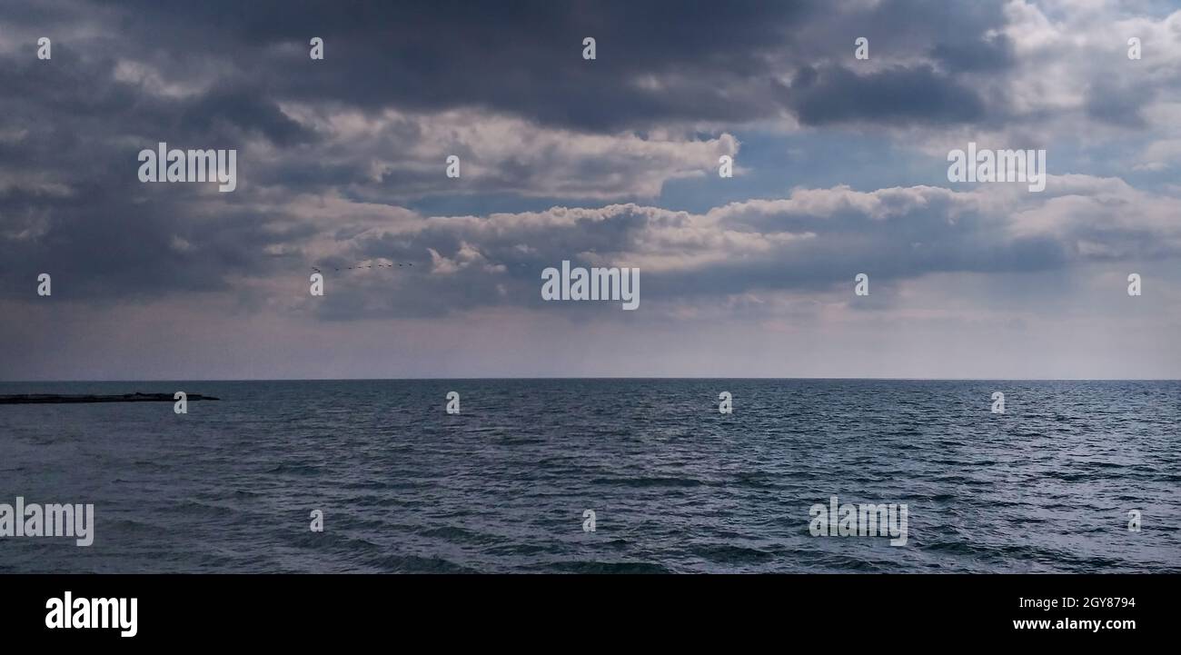 stormy background: dark sea and dramatic clouds Stock Photo - Alamy