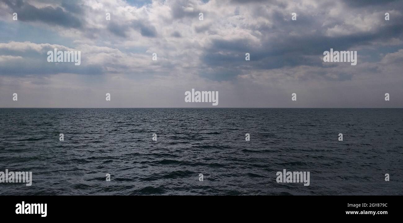 stormy background: dark sea and dramatic clouds Stock Photo - Alamy