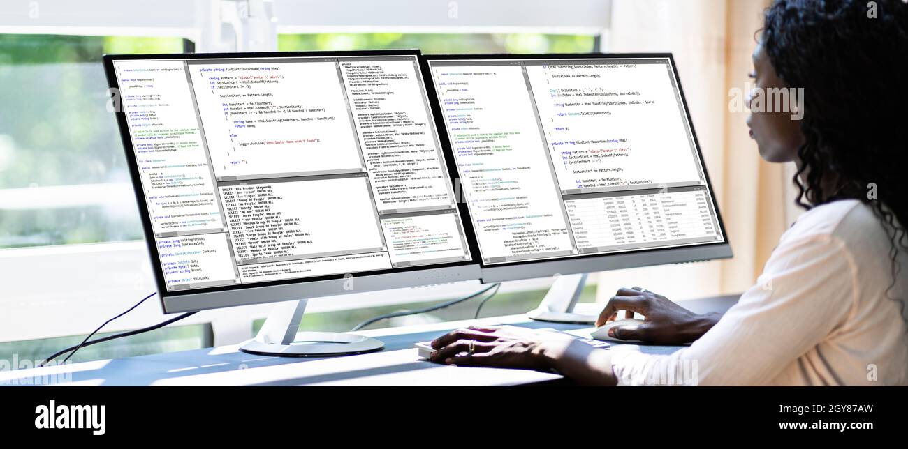 African American Woman Programmer. Girl Coding On Computer Stock Photo