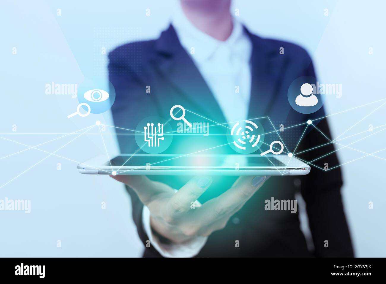 Lady In Suit Presenting Mobile Device With Futuristic Interface Tech. Stock Photo