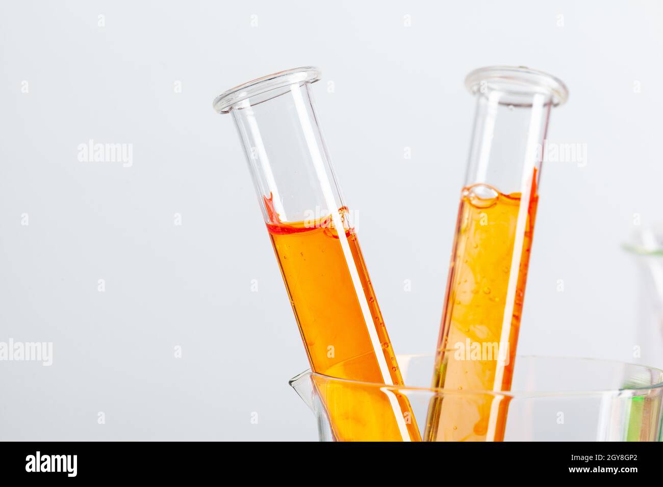 Test flasks with color samples on light grey background Stock Photo Alamy