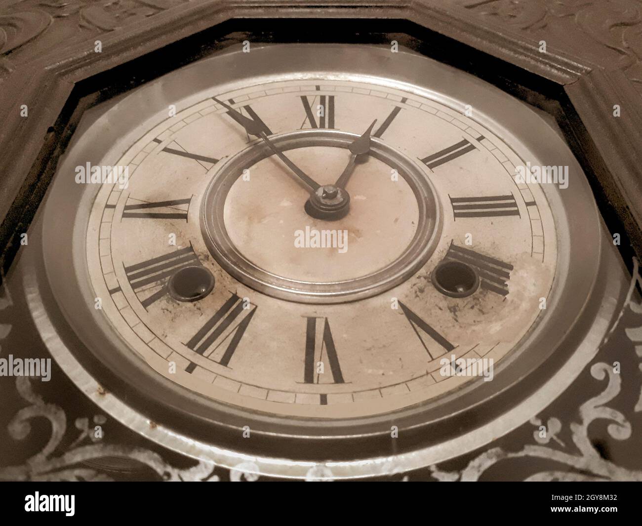 Low angle detail shot antique winding wall clock Stock Photo Alamy