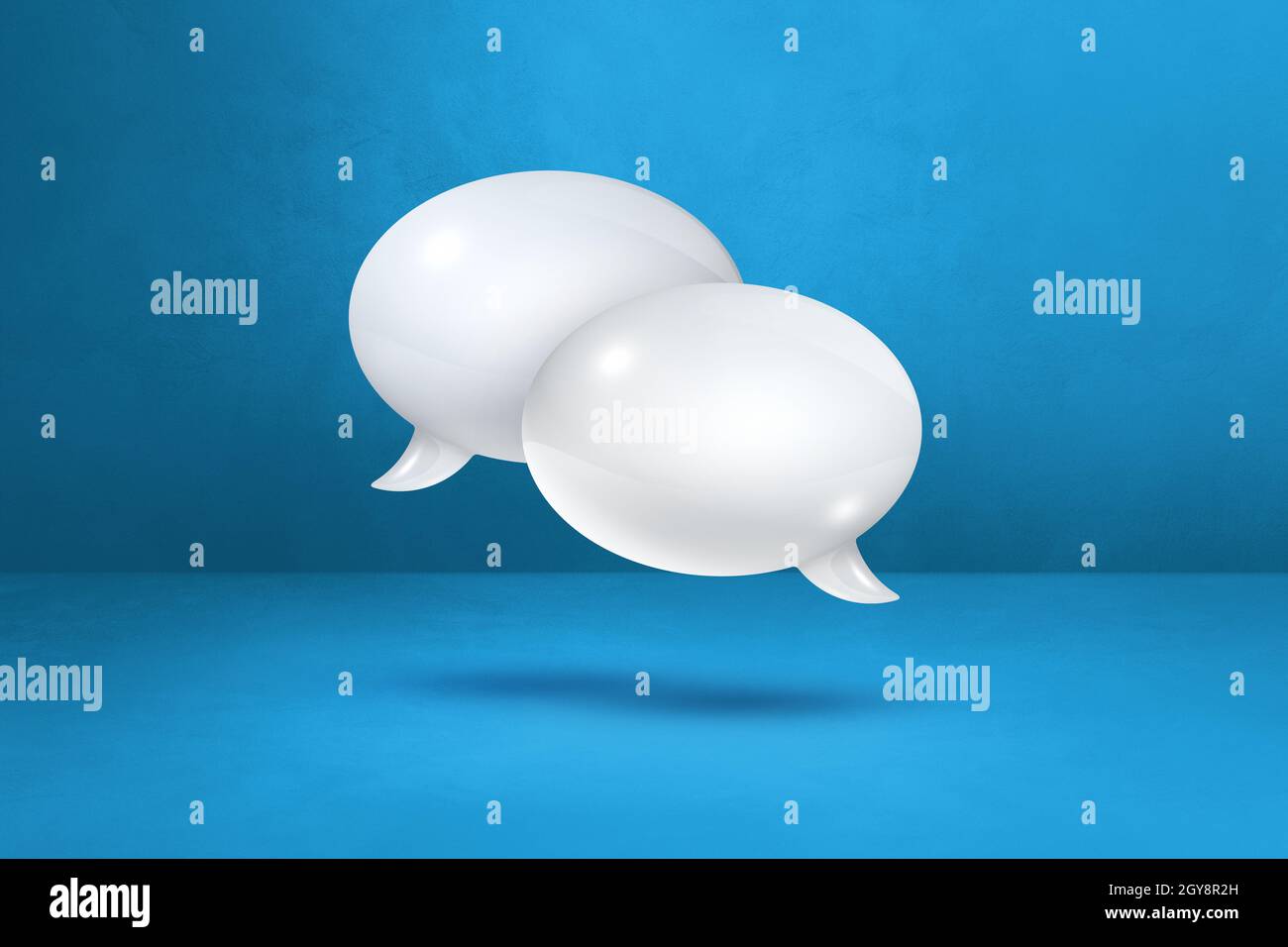 3D white speech bubbles isolated on blue background Stock Photo - Alamy