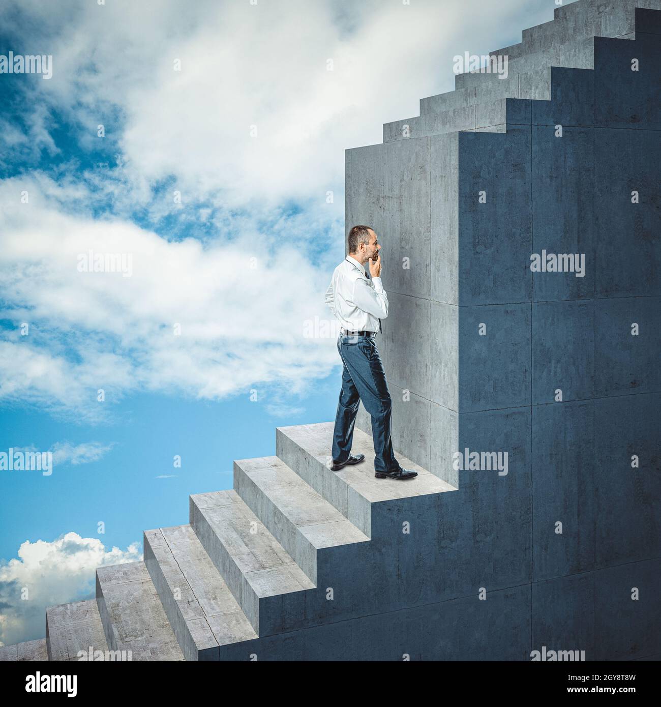 businessman climbs the stairs finds an obstacle. Stock Photo