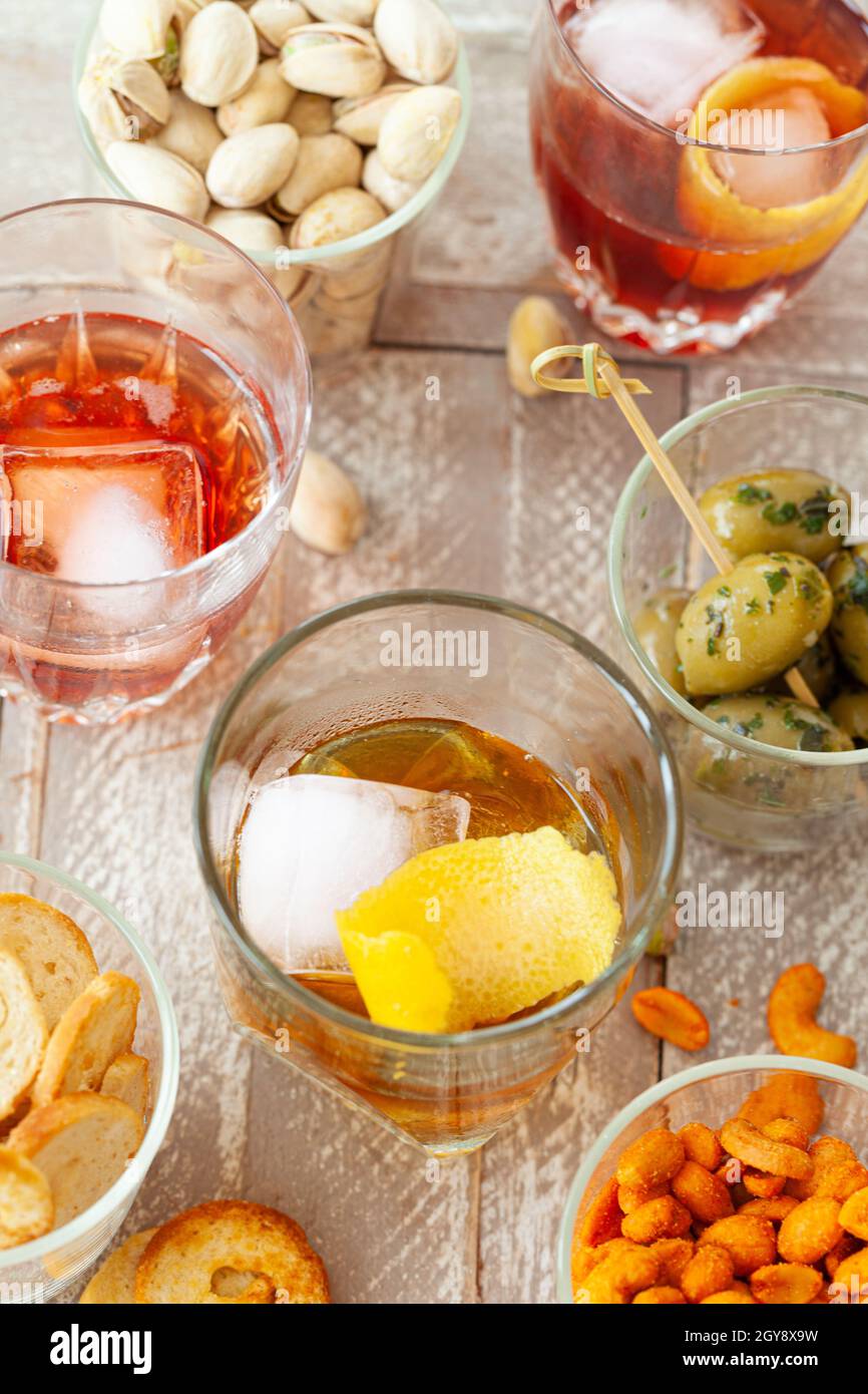 Alcoholic drinks, cocktails on ice and salty snack, appetizers Stock Photo