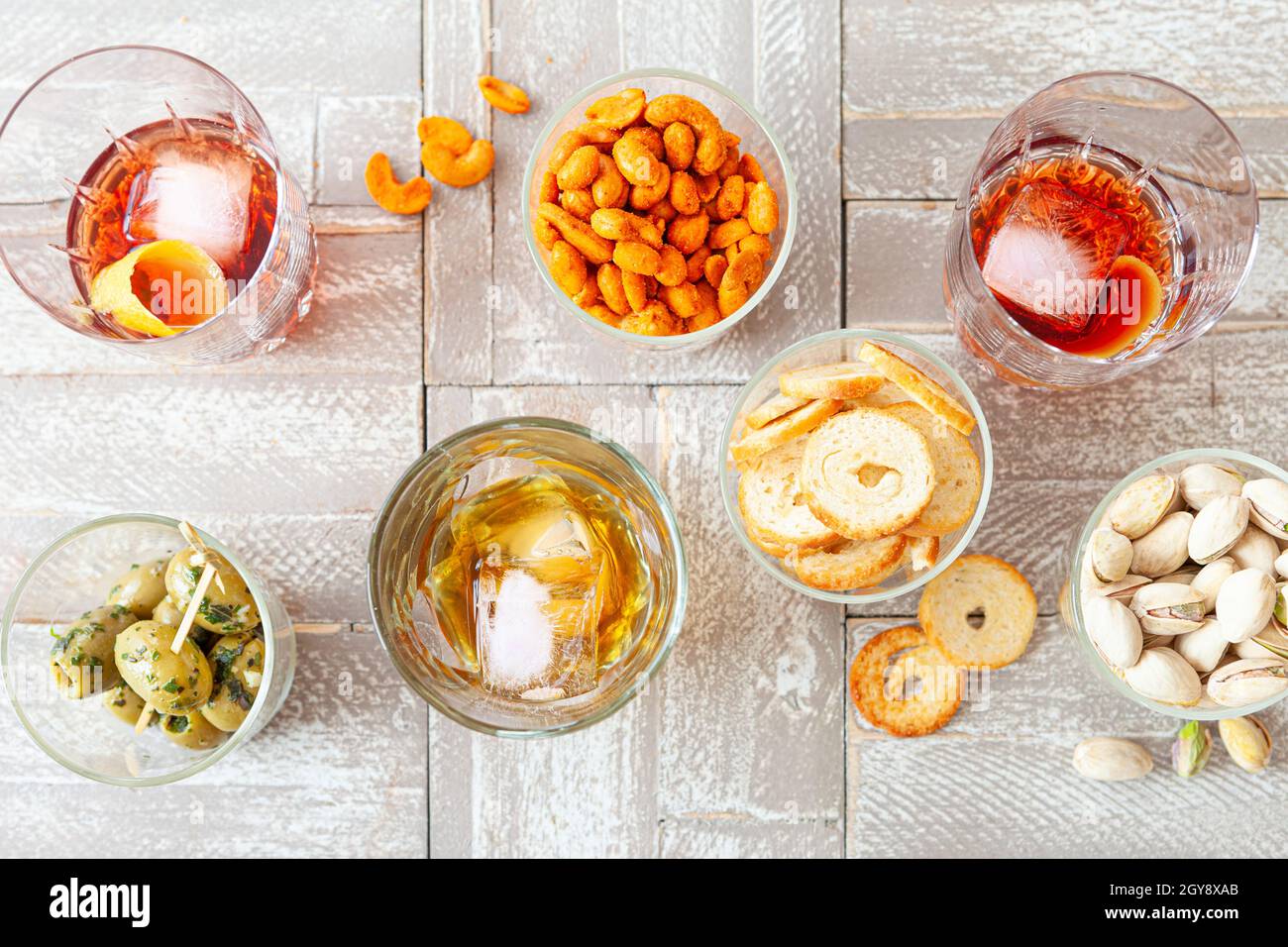 Alcoholic drinks, cocktails on ice and salty snack, appetizers Stock Photo