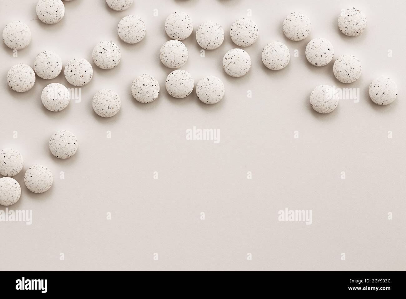 white pills on white background with copy space Stock Photo