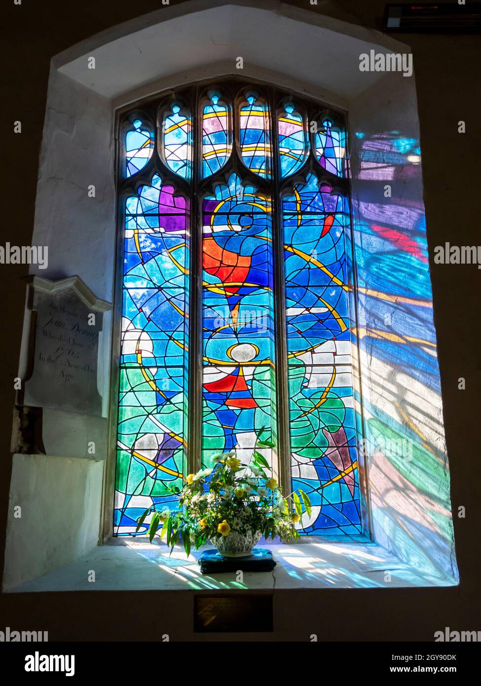 Sunlight Through A Modern Stained Glass Window In A Suffolk Church Uk Stock Photo Alamy